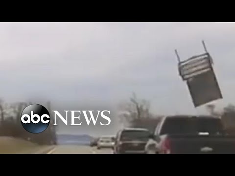 Chair flies out of pickup and strikes police vehicle