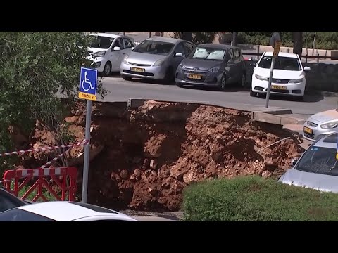 Sinkhole Opens in Parking Lot Swallowing Several Vehicles