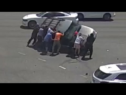 Crowd Flips SUV That Had Been in Automobile Accident